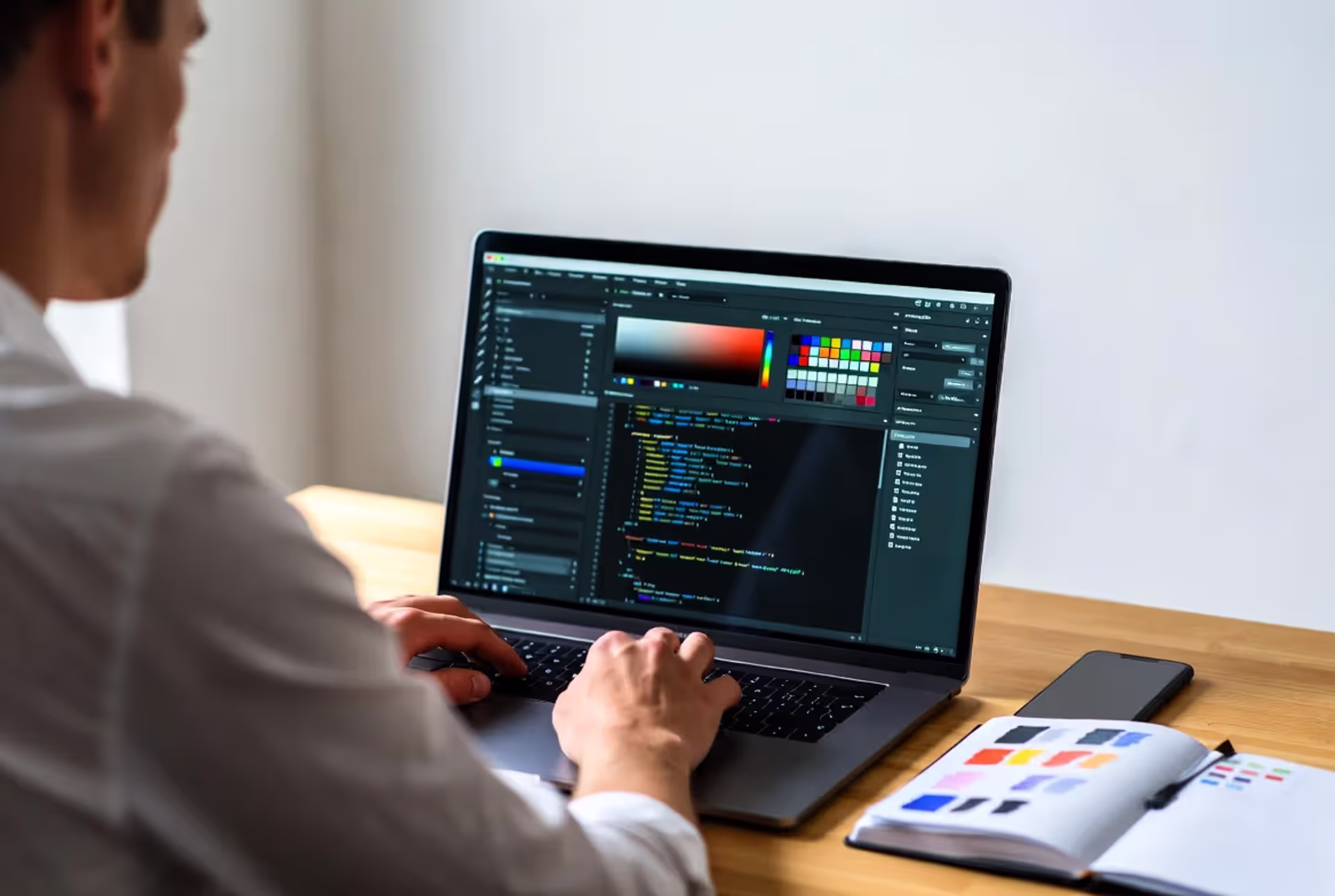 designer working with digital color codes and palette on laptop